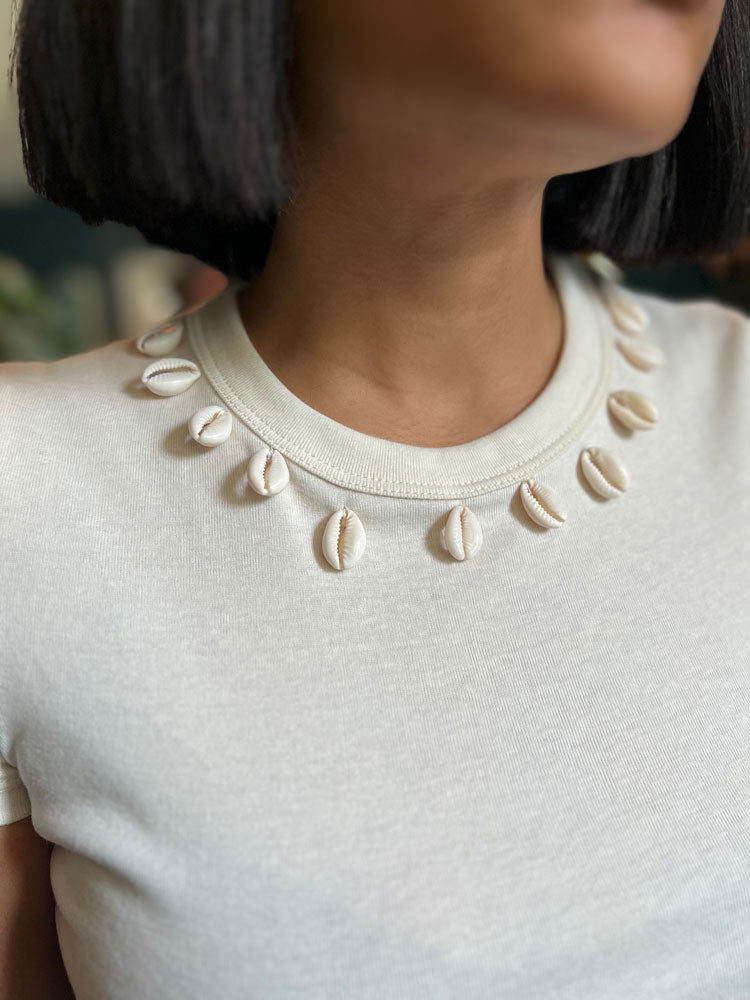 
            
                Load image into Gallery viewer, Cowrie Collar Baby Tee
            
        